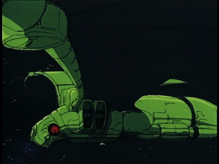 The green, batlike Reptilian flagship with one tiny Mutant craft flying alongside it