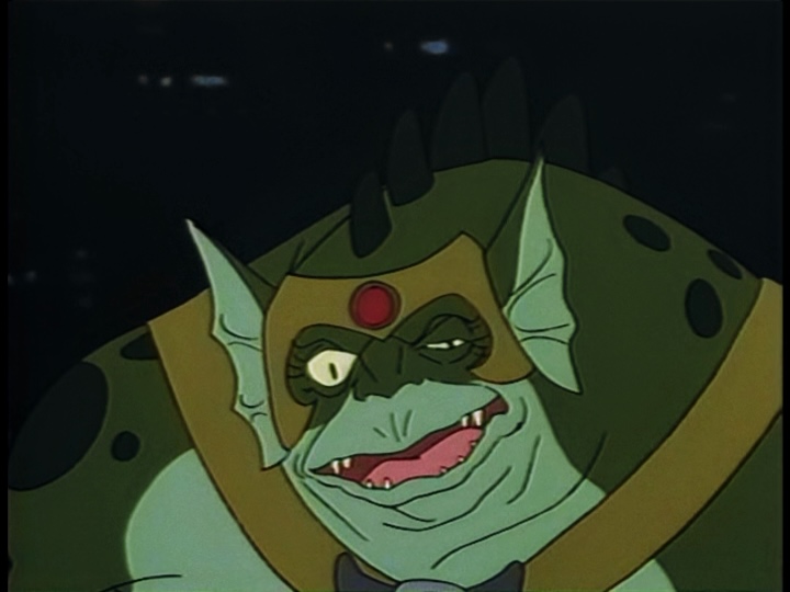 Slithe mugs for the camera, smiling and squinting one eye.